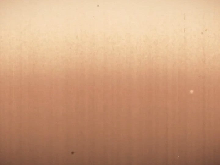 Side A, warm peach film grain texture