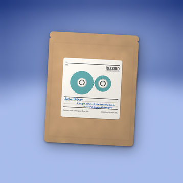 Solo Disco drip bag in a kraft pouch with the Record Coffee label